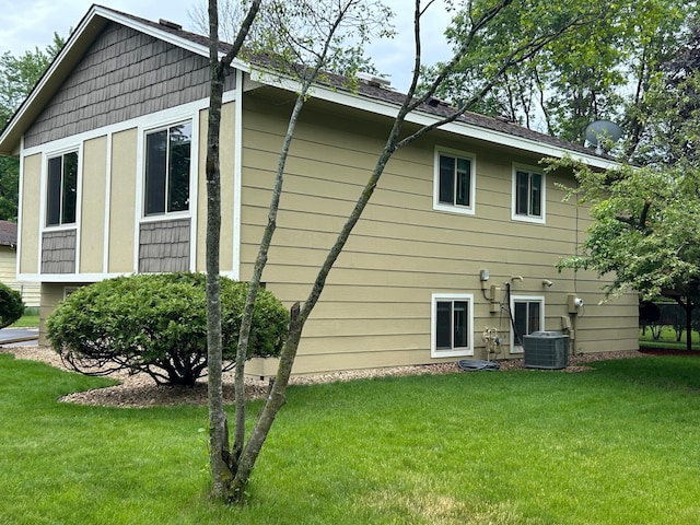3476 116th Ln NW, Coon Rapids, MN 55433 - back of property with a yard and central air condition unit