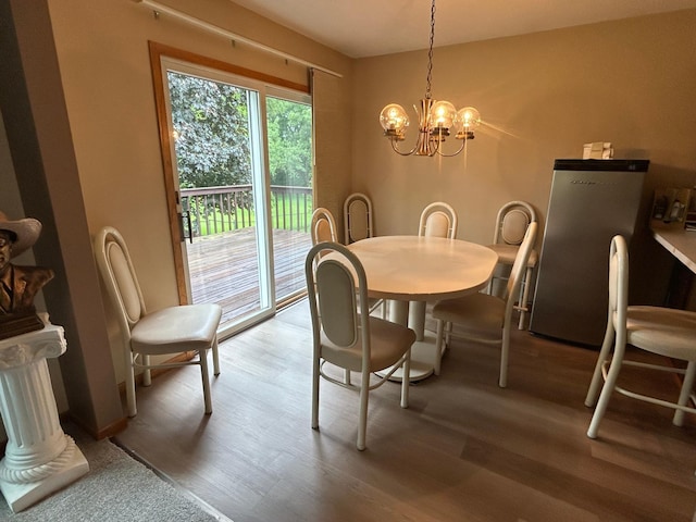 3476 116th Ln NW, Coon Rapids, MN 55433 - dining area featuring wood finished floors and a chandelier