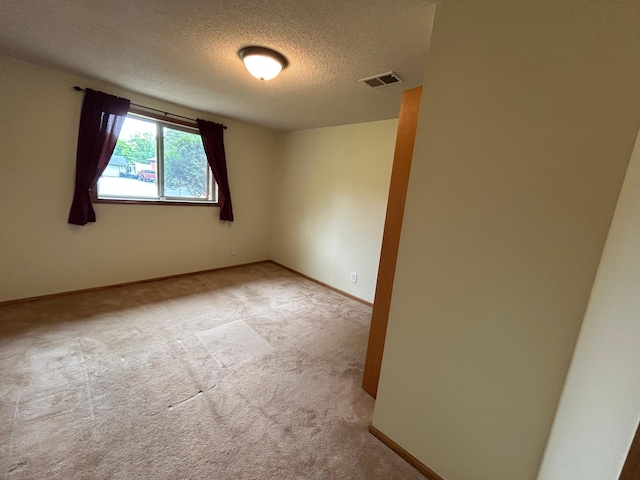 3476 116th Ln NW, Coon Rapids, MN 55433 - carpeted empty room with a textured ceiling and baseboards