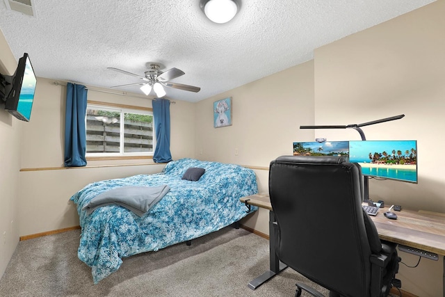 843 Northdale Blvd NW, Coon Rapids, MN 55448 - bedroom with a desk, carpet flooring, a textured ceiling, baseboards, and ceiling fan