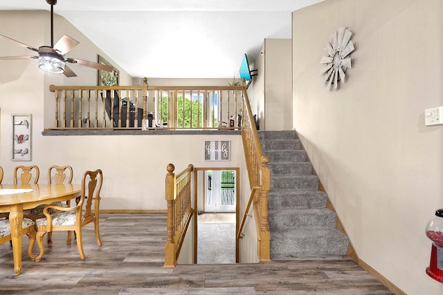 843 Northdale Blvd NW, Coon Rapids, MN 55448 - dining space featuring wood finished floors, a ceiling fan, baseboards, and lofted ceiling