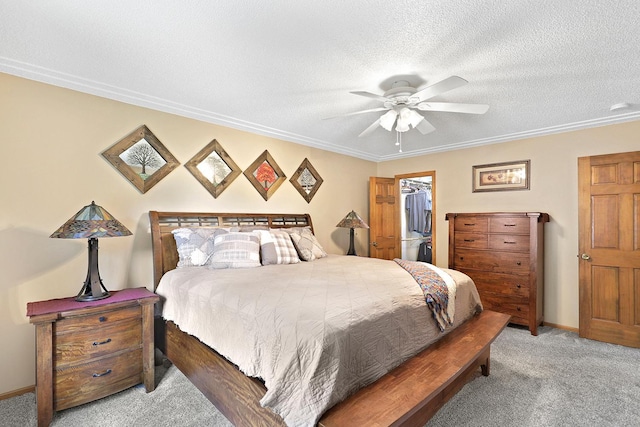 843 Northdale Blvd NW, Coon Rapids, MN 55448 - bedroom featuring carpet, ornamental molding, a spacious closet, a textured ceiling, and ceiling fan