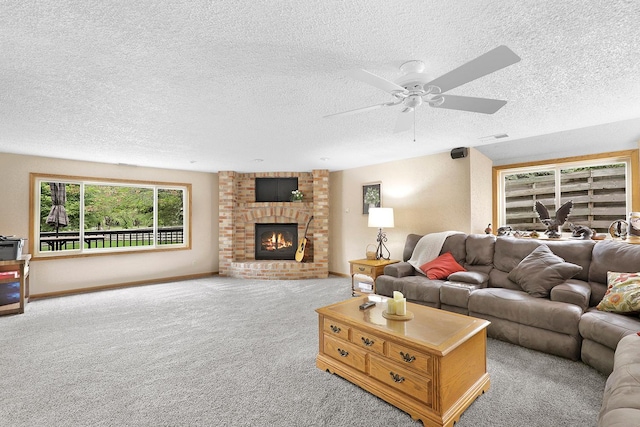843 Northdale Blvd NW, Coon Rapids, MN 55448 - living room featuring carpet, baseboards, a ceiling fan, a fireplace, and a textured ceiling