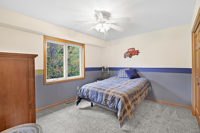 843 Northdale Blvd NW, Coon Rapids, MN 55448 - bedroom with carpet, baseboards, a textured ceiling, and ceiling fan