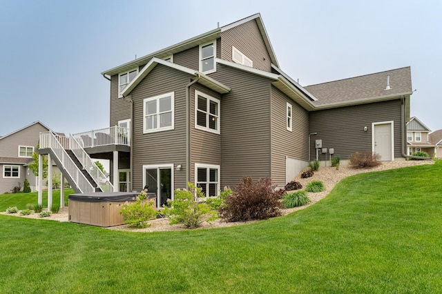 927 Southwell Enclave NE, Byron, MN 55920 - rear view of house featuring a hot tub, a deck, and a lawn