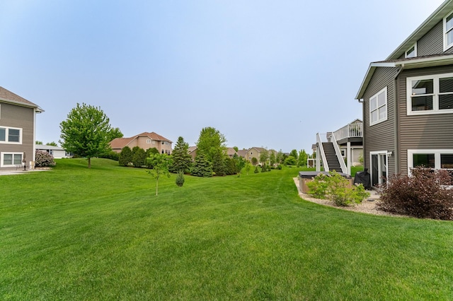 927 Southwell Enclave NE, Byron, MN 55920 - view of grassy yard featuring stairs, a residential view, and a wooden deck