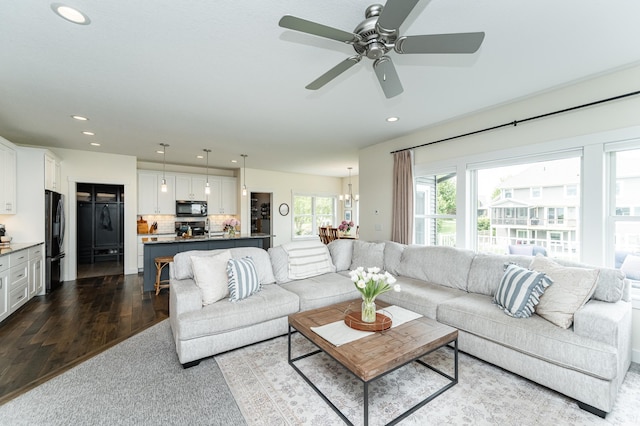 927 Southwell Enclave NE, Byron, MN 55920 - living room with recessed lighting, dark wood-style floors, a chandelier, and a ceiling fan