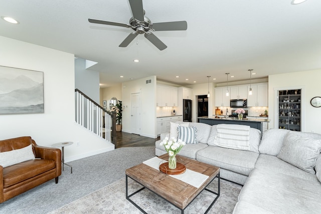 927 Southwell Enclave NE, Byron, MN 55920 - living area featuring stairs, a ceiling fan, recessed lighting, carpet flooring, and baseboards