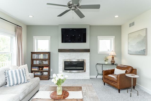 927 Southwell Enclave NE, Byron, MN 55920 - living room with carpet floors, plenty of natural light, baseboards, a stone fireplace, and recessed lighting