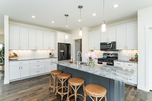 927 Southwell Enclave NE, Byron, MN 55920 - kitchen with stainless steel stove, refrigerator with ice dispenser, decorative backsplash, white cabinets, and dark wood finished floors