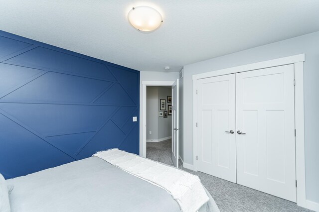 927 Southwell Enclave NE, Byron, MN 55920 - carpeted bedroom featuring baseboards and a closet