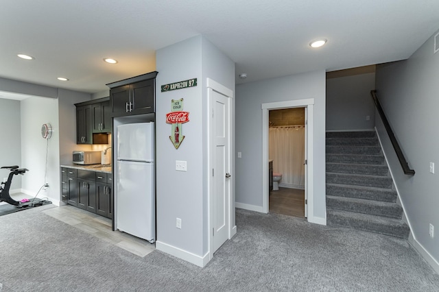 927 Southwell Enclave NE, Byron, MN 55920 - kitchen with freestanding refrigerator, light colored carpet, recessed lighting, baseboards, and light countertops