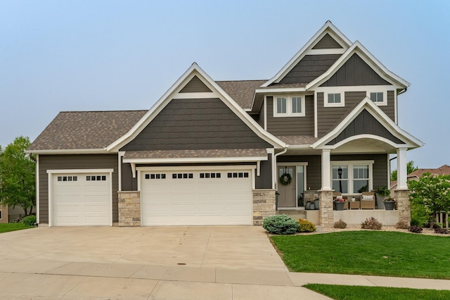 927 Southwell Enclave NE, Byron, MN 55920 - craftsman-style house with a garage, covered porch, concrete driveway, roof with shingles, and a front yard