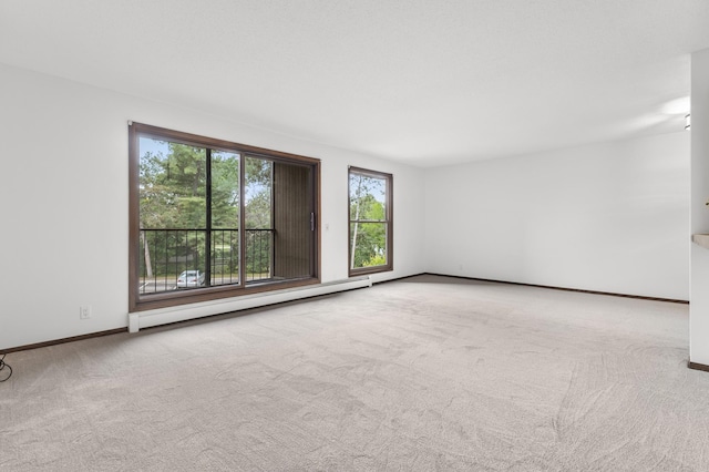 9700 Portland Ave S Unit 237, Bloomington, MN 55420 - carpeted empty room with a baseboard heating unit and baseboards