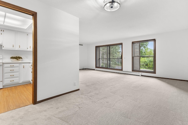 9700 Portland Ave S Unit 237, Bloomington, MN 55420 - spare room with light colored carpet, baseboard heating, and baseboards