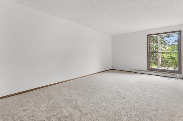 9700 Portland Ave S Unit 237, Bloomington, MN 55420 - carpeted spare room featuring baseboard heating, baseboards, and a textured ceiling