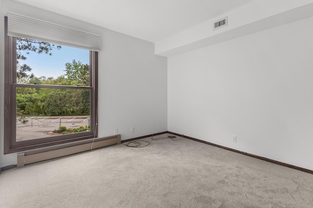 9700 Portland Ave S Unit 237, Bloomington, MN 55420 - carpeted empty room with a baseboard heating unit and baseboards
