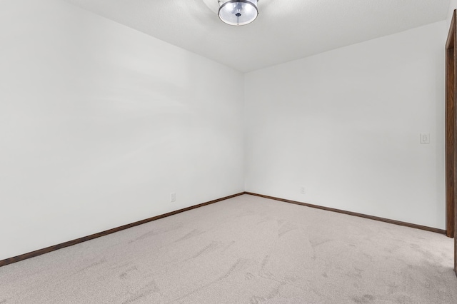 9700 Portland Ave S Unit 237, Bloomington, MN 55420 - carpeted spare room featuring baseboards