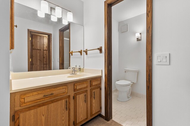 9700 Portland Ave S Unit 237, Bloomington, MN 55420 - bathroom with vanity, toilet, baseboards, and tile patterned flooring