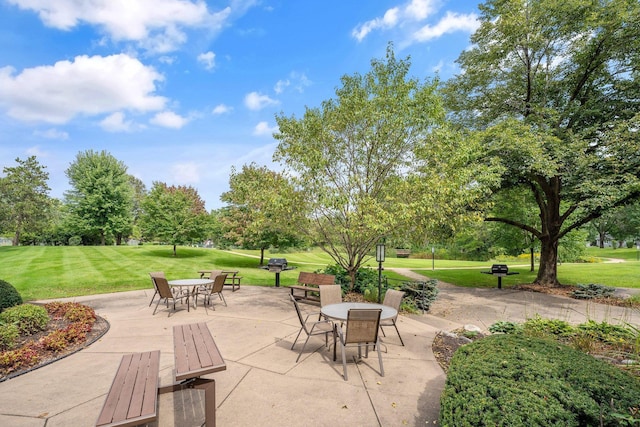 9700 Portland Ave S Unit 237, Bloomington, MN 55420 - view of patio / terrace with outdoor dining area and view of scattered trees