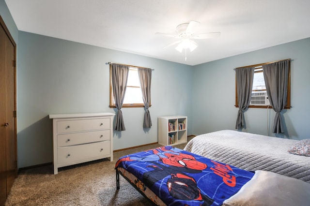 208 Concord St, West Concord, MN 55985 - carpeted bedroom with multiple windows, baseboards, and a ceiling fan