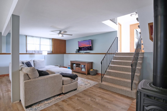 208 Concord St, West Concord, MN 55985 - living room with a ceiling fan, wood finished floors, stairway, and baseboards