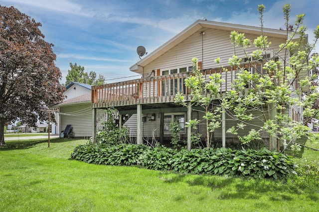 208 Concord St, West Concord, MN 55985 - rear view of property featuring a deck and a yard