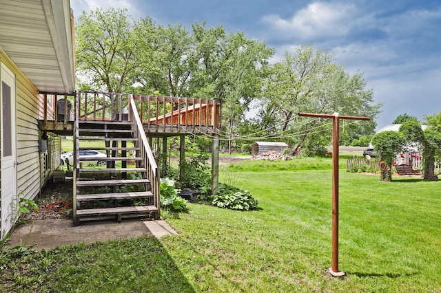 208 Concord St, West Concord, MN 55985 - view of green lawn with stairs and a deck