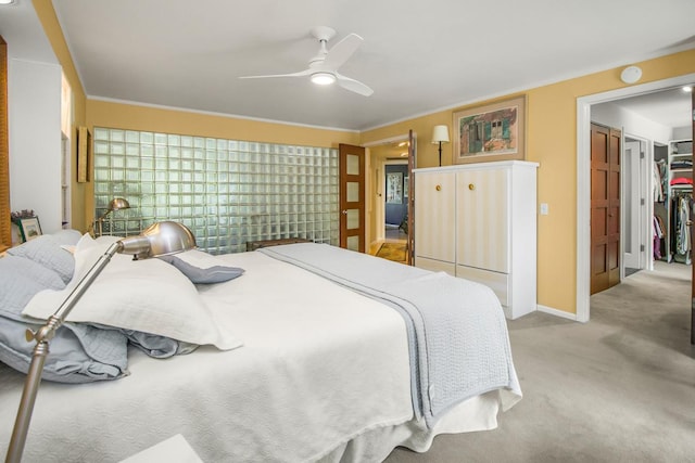 512 Laurel Ave Unit 1, Saint Paul, MN 55102 - bedroom featuring light carpet, a ceiling fan, a closet, a spacious closet, and crown molding