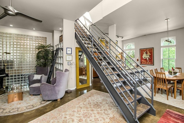 512 Laurel Ave Unit 1, Saint Paul, MN 55102 - stairs featuring finished concrete flooring and ceiling fan
