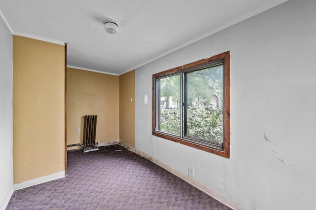 3328 5th Ave S, Minneapolis, MN 55408 - spare room with crown molding, carpet floors, baseboards, radiator heating unit, and a smoke detector