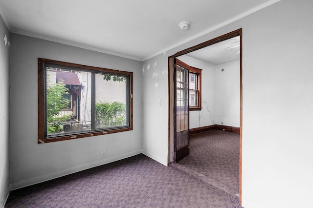 3328 5th Ave S, Minneapolis, MN 55408 - spare room featuring carpet floors, a smoke detector, baseboards, and ornamental molding