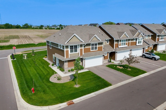 1141 Middlefield Rd, Medina, MN 55340 - townhome / multi-family property with a garage, asphalt driveway, stone siding, and a front lawn