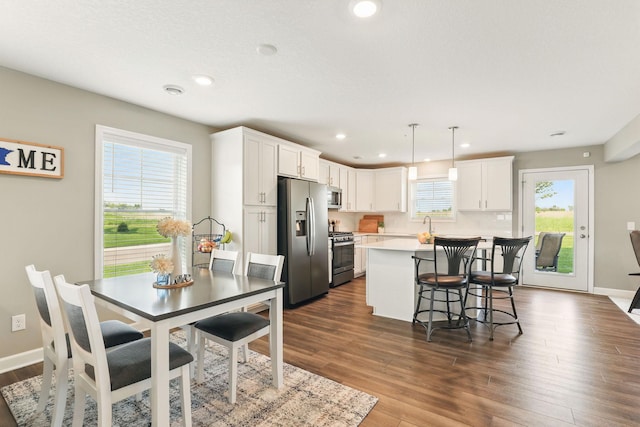 1141 Middlefield Rd, Medina, MN 55340 - dining room with dark wood finished floors, recessed lighting, and baseboards