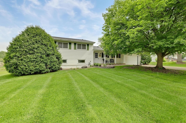 11418 Friar Ln, Minnetonka, MN 55305 - back of house featuring a yard and an attached garage