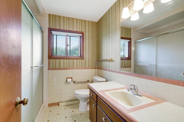 11418 Friar Ln, Minnetonka, MN 55305 - bathroom with wallpapered walls, a baseboard heating unit, a stall shower, toilet, and vanity