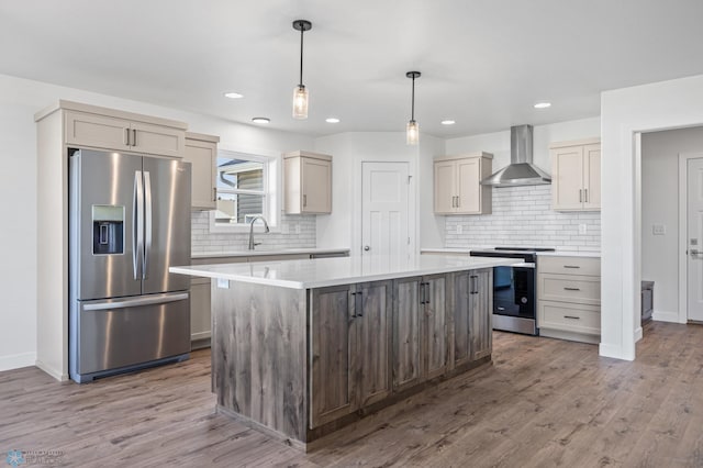 8378 62nd St S, Horace, ND 58047 - kitchen with stainless steel appliances, wall chimney exhaust hood, light countertops, tasteful backsplash, and recessed lighting
