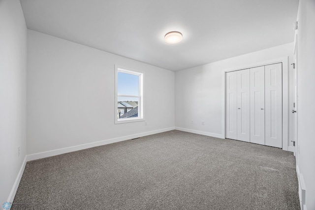 8378 62nd St S, Horace, ND 58047 - unfurnished bedroom with carpet floors, baseboards, and a closet
