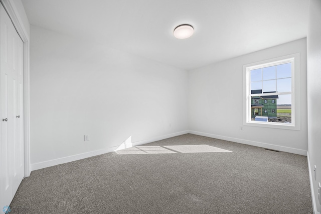 8378 62nd St S, Horace, ND 58047 - unfurnished bedroom featuring carpet flooring, baseboards, and a closet