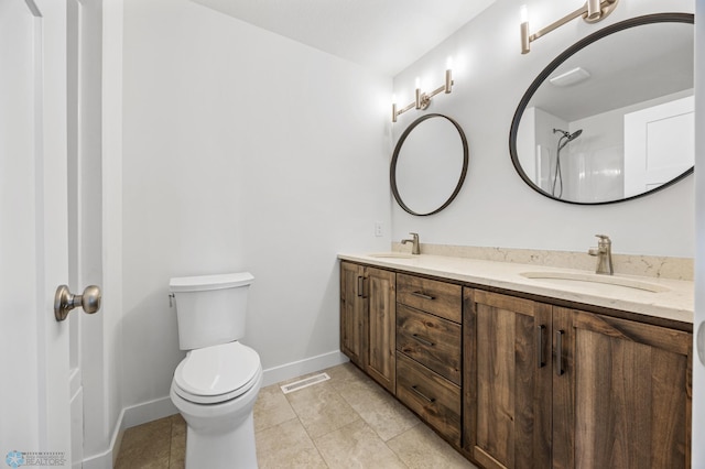 8378 62nd St S, Horace, ND 58047 - full bathroom featuring double vanity, toilet, baseboards, and tile patterned floors