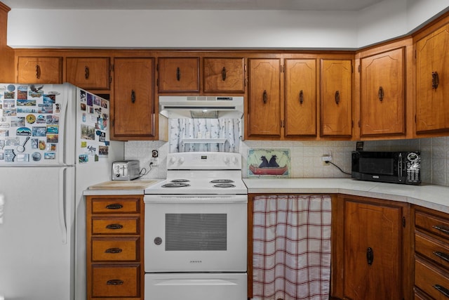 208 1st Ave NE, Geneva, MN 56035 - kitchen with under cabinet range hood, white appliances, brown cabinetry, light countertops, and tasteful backsplash