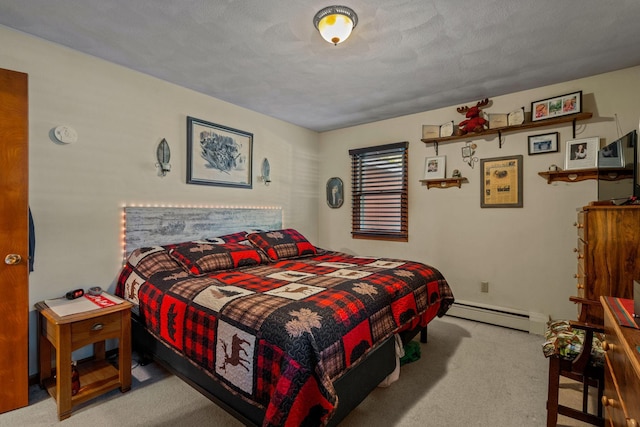 208 1st Ave NE, Geneva, MN 56035 - bedroom with a baseboard heating unit and carpet floors