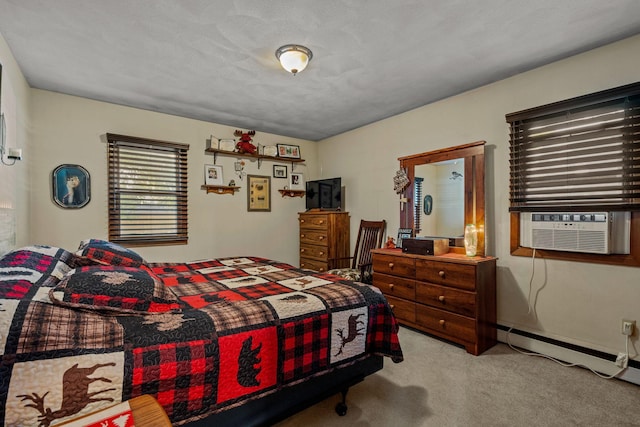 208 1st Ave NE, Geneva, MN 56035 - carpeted bedroom featuring baseboard heating and cooling unit