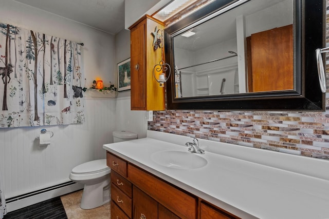 208 1st Ave NE, Geneva, MN 56035 - full bathroom with baseboard heating, vanity, toilet, and a wainscoted wall