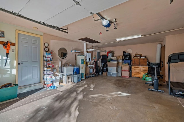208 1st Ave NE, Geneva, MN 56035 - garage with water heater and electric panel