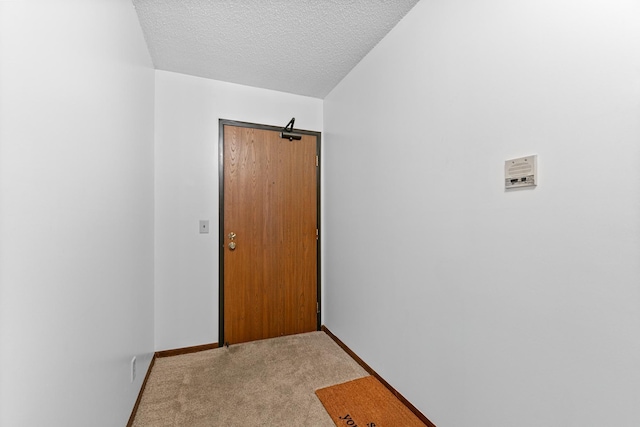 5697 Green Circle Dr Unit 304, Minnetonka, MN 55343 - entryway with light colored carpet, a textured ceiling, and baseboards