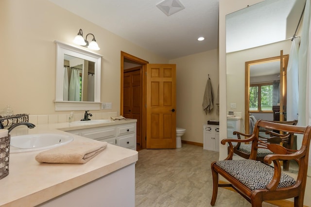 8935 180th St W, Faribault, MN 55021 - full bath featuring vanity, vaulted ceiling, recessed lighting, and toilet