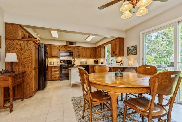 8935 180th St W, Faribault, MN 55021 - dining space featuring healthy amount of natural light, light tile patterned floors, and a ceiling fan