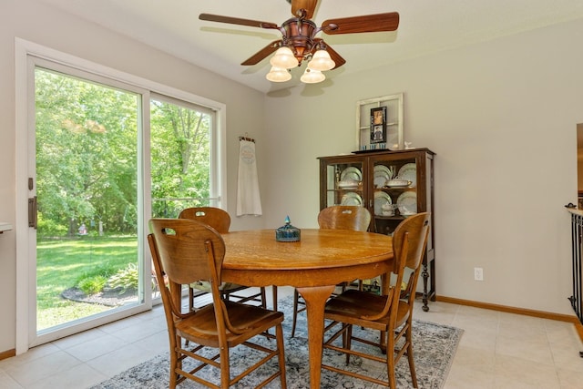 8935 180th St W, Faribault, MN 55021 - dining space featuring light tile patterned flooring, a ceiling fan, and baseboards