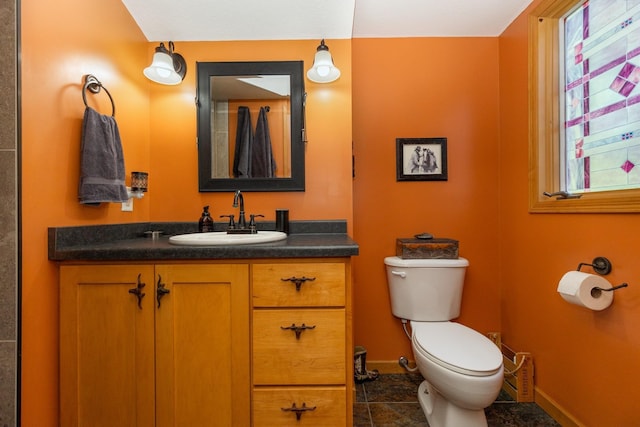8935 180th St W, Faribault, MN 55021 - bathroom featuring toilet, vanity, baseboards, and tile patterned flooring